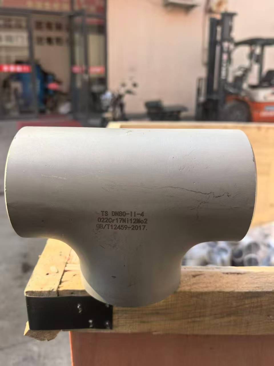 Stainless steel fitting with visible product marking